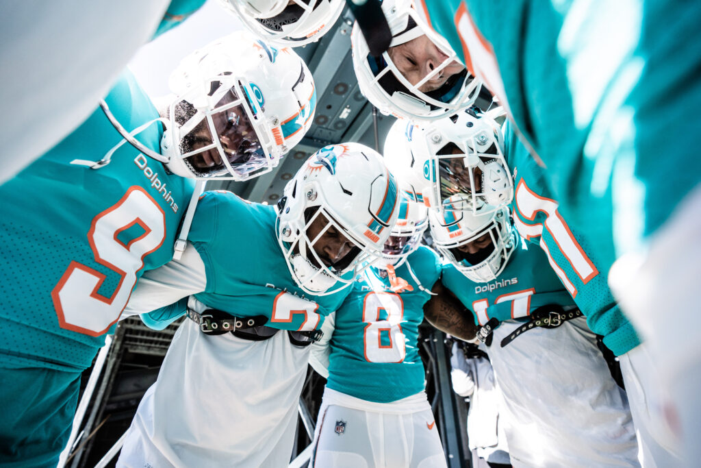 Miami Dolphins huddle up before an NFL football game
